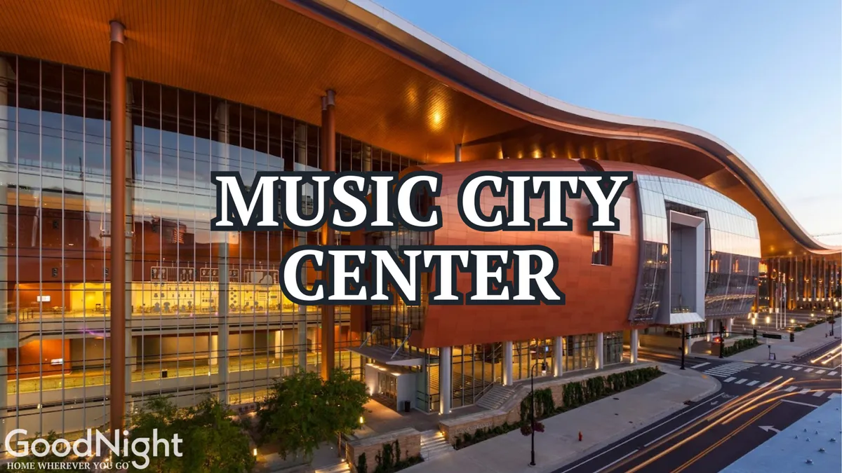 This image showcases the Music City Center's unique architectural design, large glass windows, and prominent signage. The exterior is bustling with activity, reflecting its role as a hub for events and conferences.